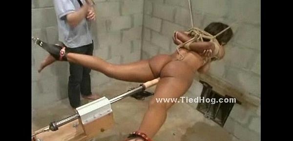  Nasty mistress with ponytail slapping naked sex slave tied like a hog in ropes